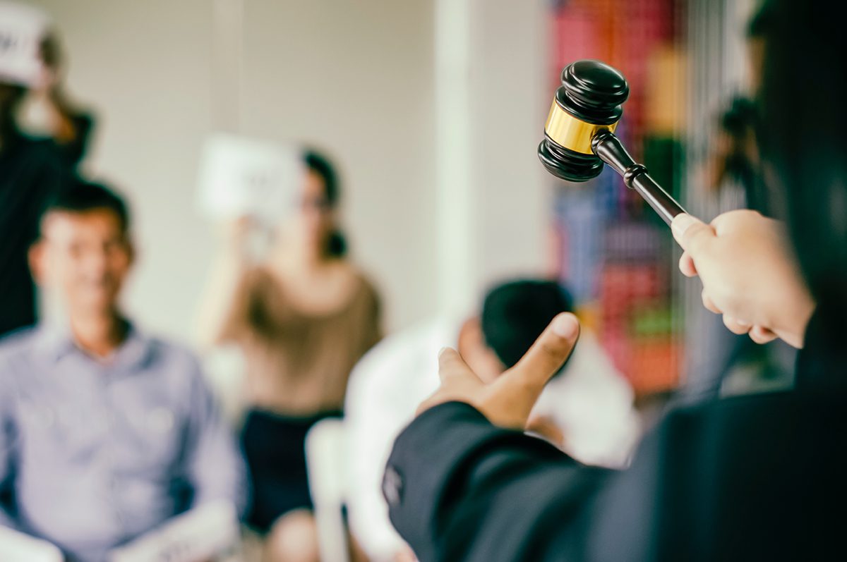 Gavel in focus, commanding attention at a property auctions, where bidders eagerly await to secure their next investment